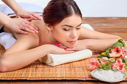 Image of a massage therapist's hands performing a relaxing massage technique